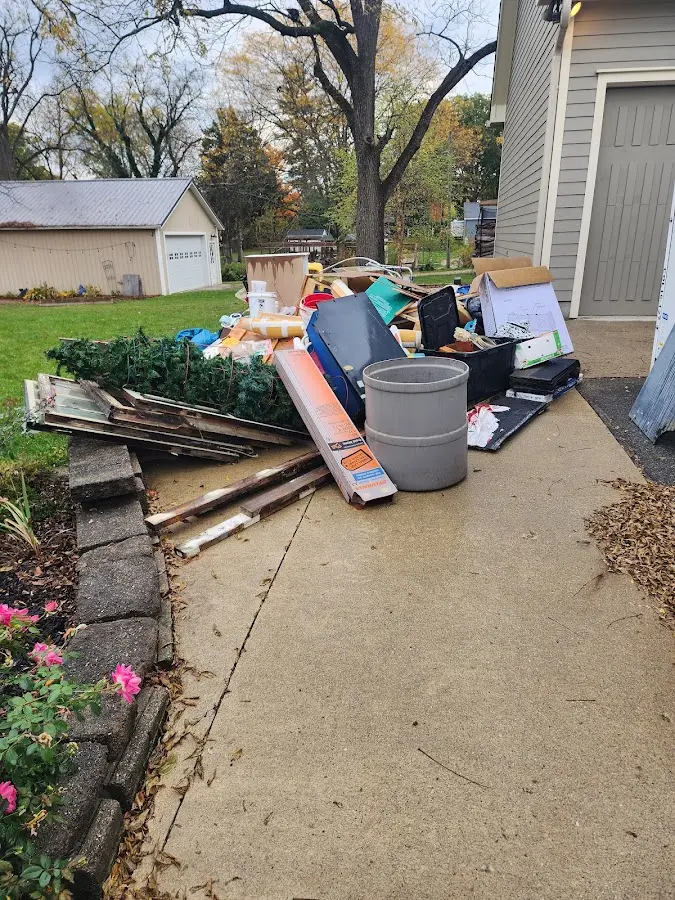 Dumpster being loaded with debris for 30 Yard Dumpster Rental in Kalispell